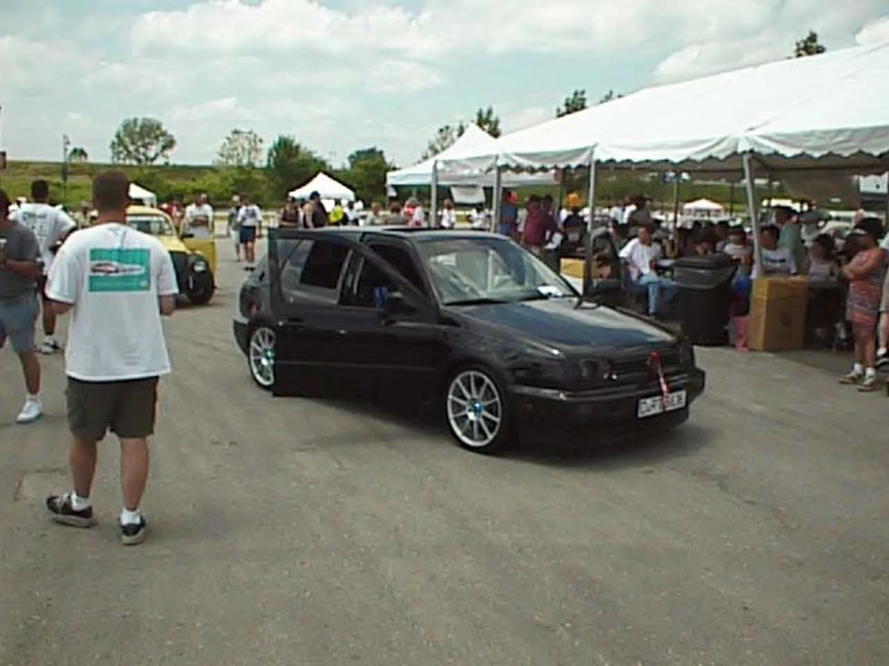 Golf Driving Through Crowd